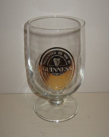 beer glass from the Guinness  brewery in Ireland with the inscription 'Guinness Presented To You By Friends Of The Guinnless The Toucan Inn London'