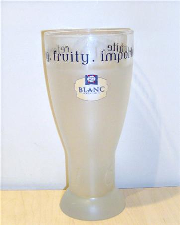 beer glass from the Kronenbourg brewery in France with the inscription 'Kronenbourg 1664 Blanc White Beer Refreshing,Fruity,Imorted,White'