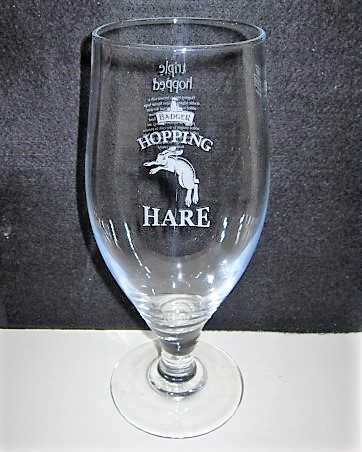 beer glass from the Hall & Woodhouse brewery in England with the inscription 'Badger Hopping Hare'