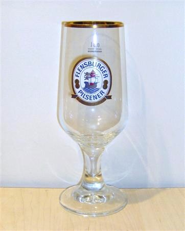 beer glass from the Flensburger  brewery in Germany with the inscription 'Flensburger Pilsener Herbwurzig &Frisch'