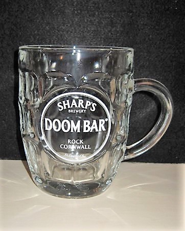 beer glass from the Sharp's brewery in England with the inscription 'Sharp's Brewery DOOM BAR Rock Cornwall  ALC 4% vol'