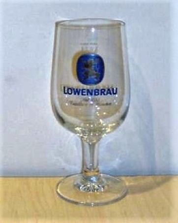 beer glass from the Lowenbrau brewery in Germany with the inscription 'Lowenbrau siet 1383 Tradition In Munchen'