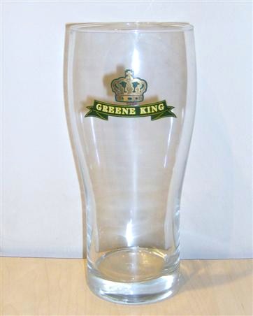 beer glass from the Greene King brewery in England with the inscription 'Green King Jubilation Ale Celebrating Her Majestys 2002 Golden Jubilee'