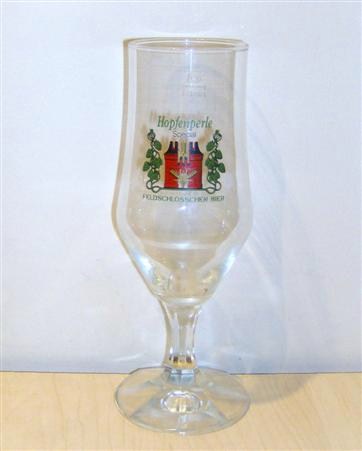 beer glass from the Feldschlosschen brewery in Switzerland with the inscription 'Hopfenperle Special Feldschlosschen Bier'