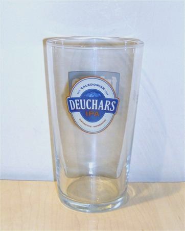 beer glass from the Caledonian  brewery in Scotland with the inscription 'Caledonian Deuchars IPA Distinctive Refreshing'