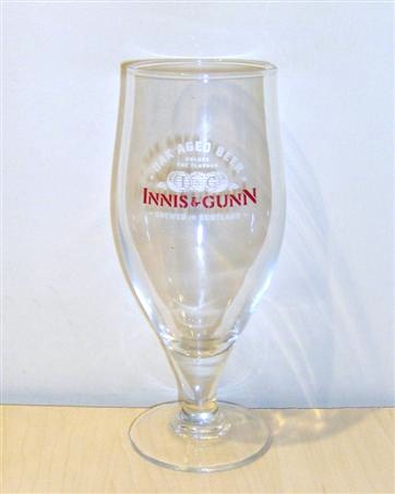 beer glass from the Innis&Gunn brewery in Scotland with the inscription 'Dark Aged Beer Unlock The Flavour I&G Innis&Gunn Brewed In Scotland'