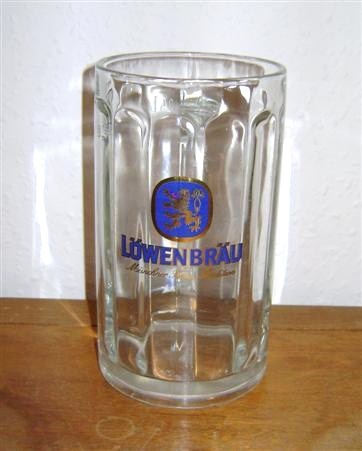 beer glass from the Lowenbrau brewery in Germany with the inscription 'Lowenbrau Munchner Braw Tradition'