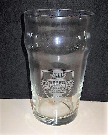 beer glass from the Charles Wells brewery in England with the inscription 'Wells Bombardier English Premium Bitter Alc 5.2% Vol'