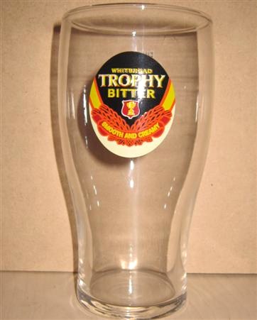 beer glass from the Whitbread  brewery in England with the inscription 'Whitbread Trophy Bitter Smooth And Creamy'