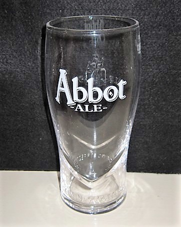 beer glass from the Greene King brewery in England with the inscription 'Abbot Ale Brewing Perfection'