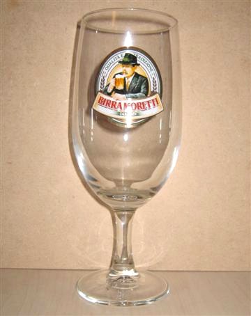 beer glass from the Moretti brewery in Italy with the inscription 'Qualita E Tradizione Birra Moretti Dal 1859'