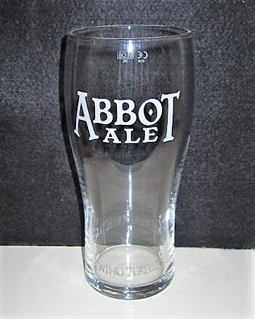 beer glass from the Greene King brewery in England with the inscription 'Abbot Ale Brewing Perfection'