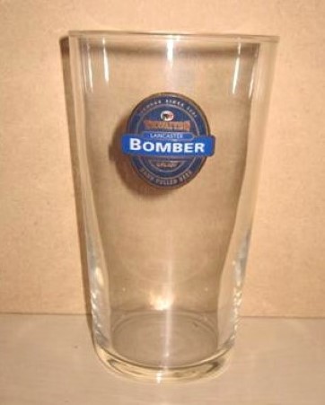 beer glass from the Thwaites brewery in England with the inscription 'Thwaites Lancaster Bomber Hand Pulled Beer'
