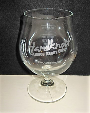 beer glass from the Hardknott brewery in England with the inscription 'Hardknott Serious About Beer www.HARDKNOTT.COM'