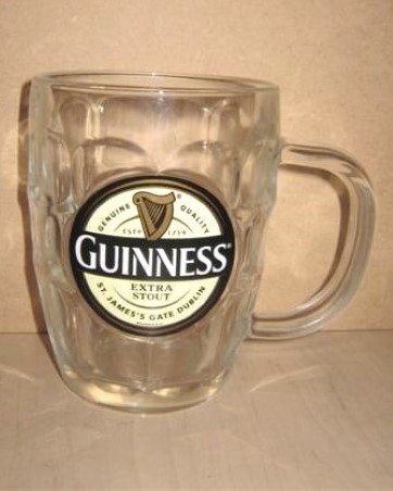 beer glass from the Guinness  brewery in Ireland with the inscription 'Genuine Quality Guinness Estd 1759. Extra Stout St James's Gate Dublin'