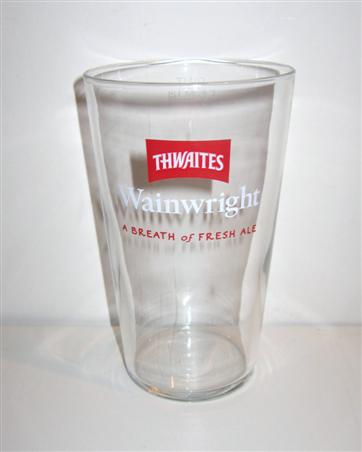 beer glass from the Thwaites brewery in England with the inscription 'Thwaites Wanwright. A Breath Of Fresh Ale'