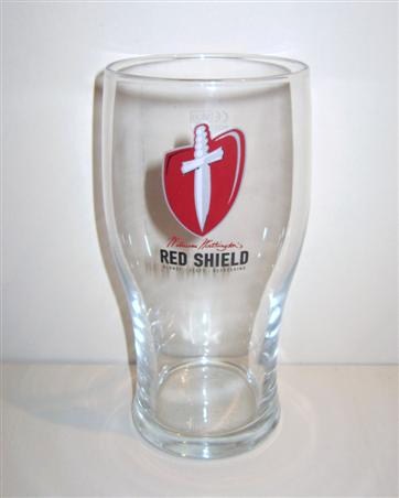 beer glass from the Worthington brewery in England with the inscription 'Worthington Red Shield Blond Zesty Refreshing'