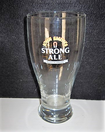 beer glass from the John Smith's brewery in England with the inscription 'John Smith's 1758 Strong Ale Brewed In Yorkshire'