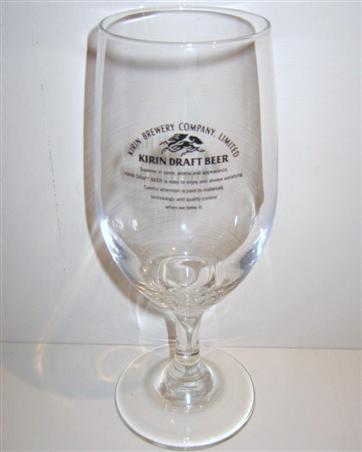 beer glass from the Kirin brewery in Japan with the inscription 'Kirin Brewery Company Limited. Kirin Draft Beer. Superior Taste Aroma And Appeance. Kirin Draft Beer Is Easy To Enjoy And Is Satisfying. Carful Attention Is Paid To Material's Technology And Quility Control When We Brew It'