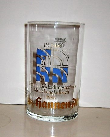 beer glass from the Hannen  brewery in Germany with the inscription '135 Jahre Textil U Bekleidungstechnik Munchengladbach 1986 Hannen Alt'