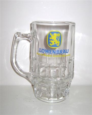beer glass from the Lowenbrau brewery in Germany with the inscription 'Lowenbrau. Born In Munich, Loved By The World'