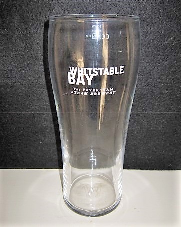 beer glass from the Shepherd Neame brewery in England with the inscription 'Whitstable Bay. The Faversham Steam Brewery'