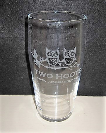 beer glass from the Joseph Holt brewery in England with the inscription 'Two Hoots WWW. Joseph Holt .Com'