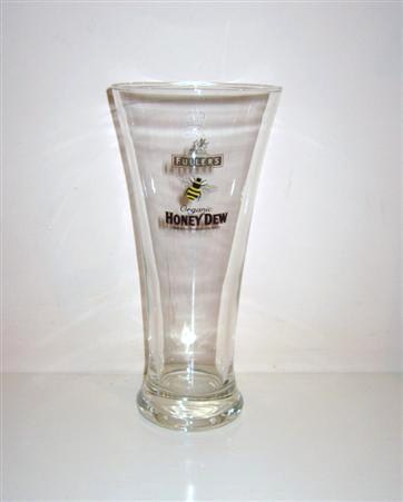 beer glass from the Fuller's brewery in England with the inscription 'Fullers Chiswick. Organic Honey Dew. Wonderfully Refreshing Ale'