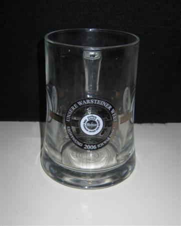 beer glass from the Warsteiner brewery in Germany with the inscription 'Unsere Warstiner Welt Eroffnung 2006 Kh War Dazel Eine Konigin Unter Den Bieren'