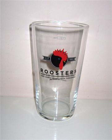 beer glass from the Roosters brewery in England with the inscription 'EST 1993 Roosters. Free Range Beers From Yorkshire'