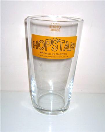 beer glass from the Hopstar  brewery in England with the inscription 'Hopstar Brewed In Darwen. www.hopstarbrewery.co.uk '