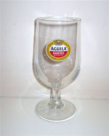 beer glass from the Aguila  brewery in Spain with the inscription 'Aguila Amstel.100% Malta'