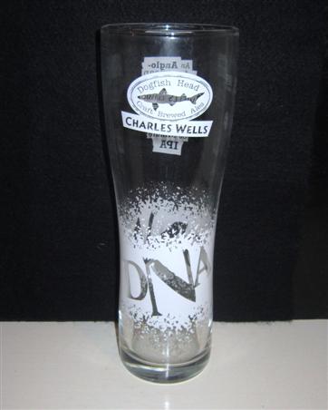 beer glass from the Charles Wells brewery in England with the inscription 'Dogfish Head. Charles Wells DNA'