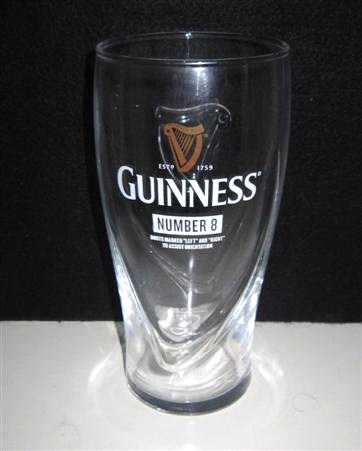 beer glass from the Guinness  brewery in Ireland with the inscription 'Guinness Estd 1759, Number 8 Boots Marked Left And Right To Assist OrientationCoach, Wise Words, Tal Tails, Murky Past'