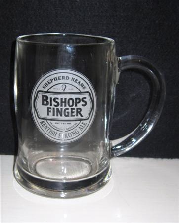 beer glass from the Shepherd Neame brewery in England with the inscription 'Bishops Finger, Shepherd Neam Since 1698 Alc 5.4% Vol Traditional Brewers Kentish Strong Ale'