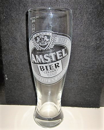 beer glass from the Amstel brewery in Netherlands with the inscription 'Amstel Lager Bier Amstel Brouwerij B.V. Amsterdam Holland Quality Product Amstel Bier Lager '