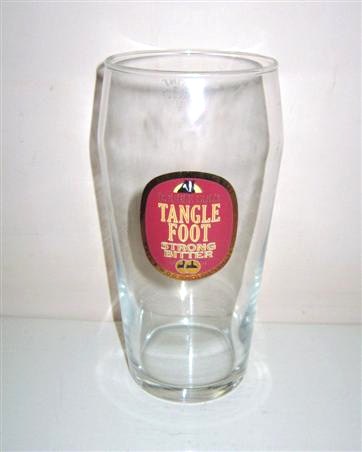 beer glass from the Hall & Woodhouse brewery in England with the inscription 'Double Gold Tanglefoot Strong Bitter. Inderpendent Brewers. Hall & Woodhouse Limited'