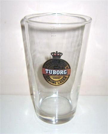 beer glass from the Tuborg brewery in Denmark with the inscription 'Tuborg Gold Strong Lager, Turborg Brewed Since 1895 Copenhagen Denmark'