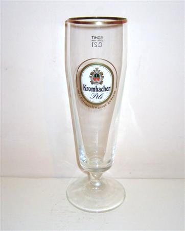 beer glass from the Krombacher brewery in Germany with the inscription 'Krombacher Pils Mit Felsquellwasser Gebraut'