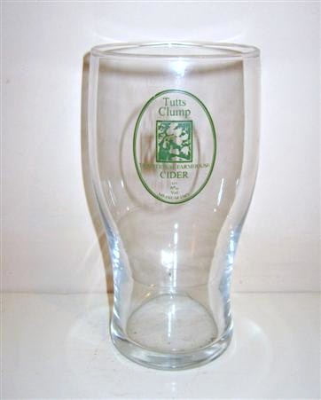 beer glass from the Tutts Chump brewery in England with the inscription 'Tutts Chump, Traditional Farmhouse Cider Alc 6.5 Vol, Medium Dry'