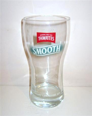 beer glass from the Thwaites brewery in England with the inscription 'Brewer Since 1807 Thwaites Creamy Lancashire Ale'