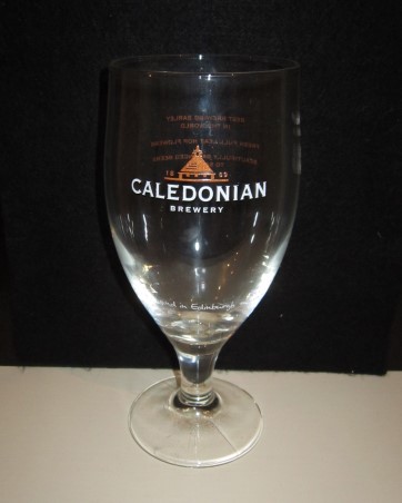 beer glass from the Caledonian  brewery in Scotland with the inscription '1869 Caledonian Brewery, Brewed By Hand In Edinburgh @ Caledonianbeer'