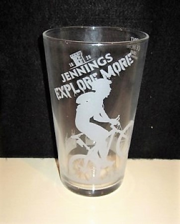 beer glass from the Jennings brewery in England with the inscription '1830 Jennings Explore More'