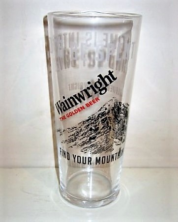 beer glass from the Thwaites brewery in England with the inscription 'Wainwright, The Golden Beer, Find Your Mountain'