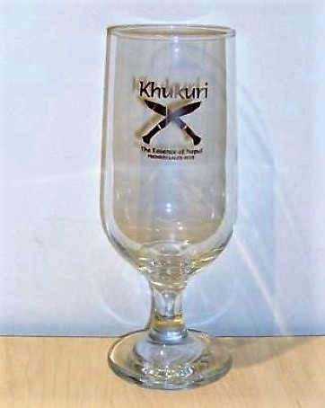 beer glass from the J W Lees brewery in England with the inscription 'Khukuri The Essence Of Nepal Premium Lager Beer'