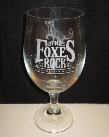 beer glass from the Station Works brewery in Northern Ireland with the inscription 'The Foxes Rock, Est 2015 Hand Crafted Irish Ales'