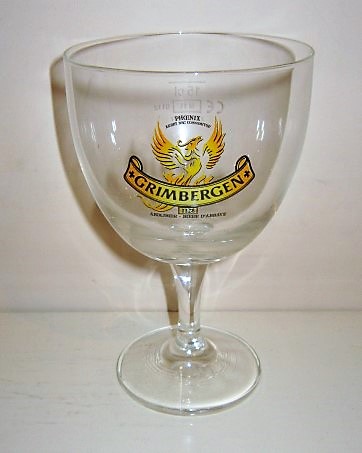 beer glass from the Grimbergen brewery in Belgium with the inscription 'Grimbergen, Ardet Nec Consumitur, Abdijbier Biere Ad'abbye'