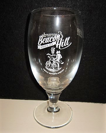 beer glass from the Everards brewery in England with the inscription 'Beacon Hill Amber Ale, Lightly Hopped & Morish'
