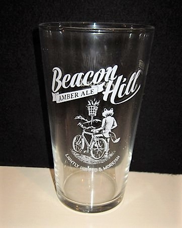 beer glass from the Everards brewery in England with the inscription 'Beacon Hill Amber Ale, Lightly Hopped & Morish'