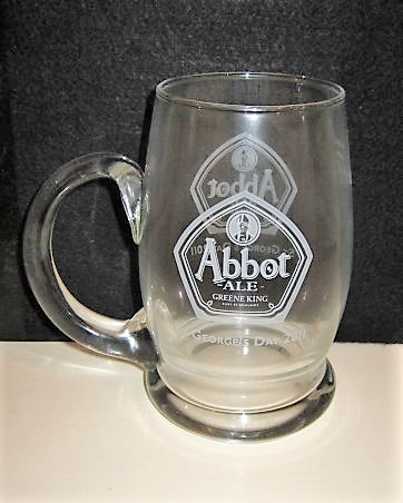 beer glass from the Greene King brewery in England with the inscription 'Abbot Ale Greene King, Bury St Edmounds. St George's day 2011'